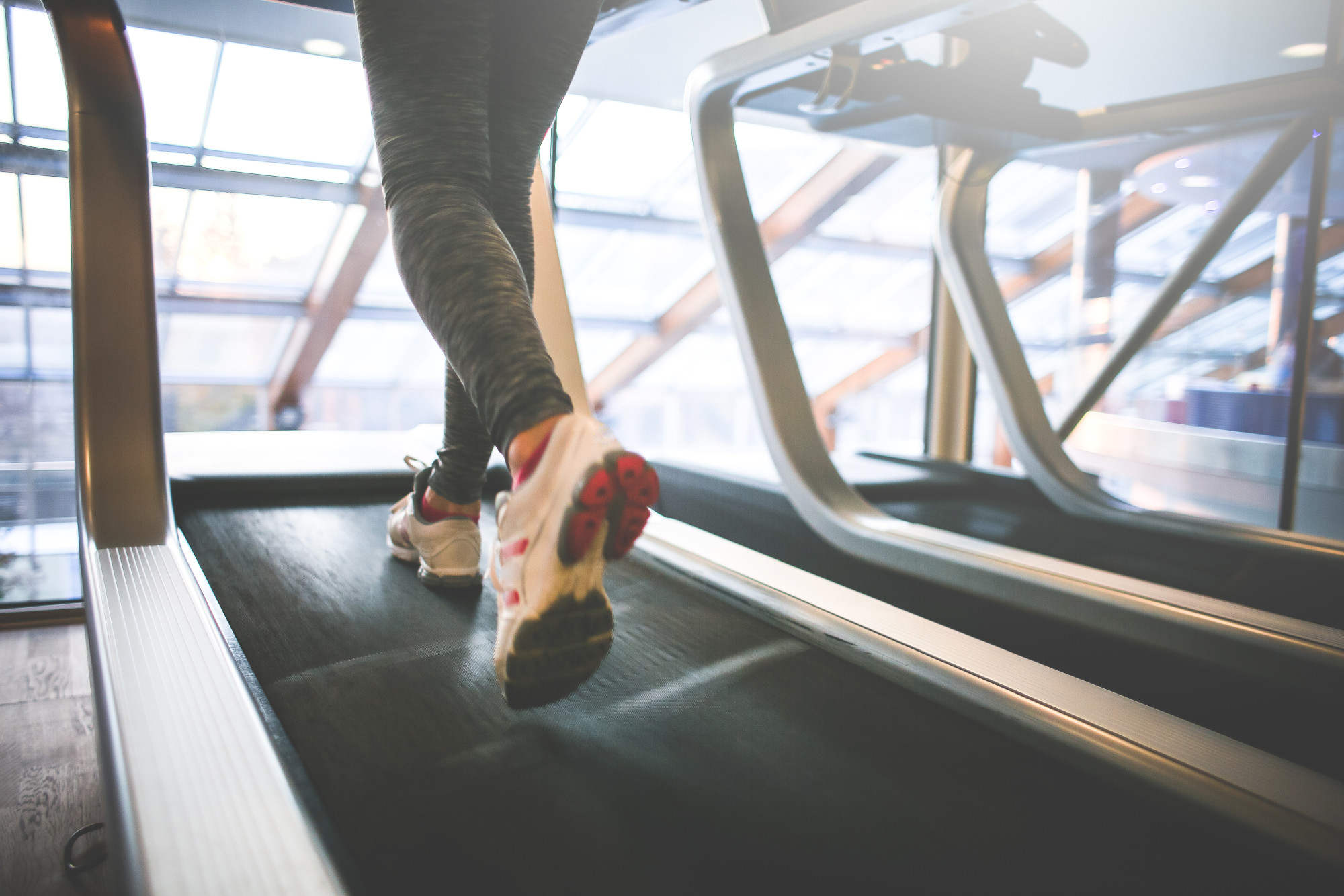 A girl running on a treadmill.